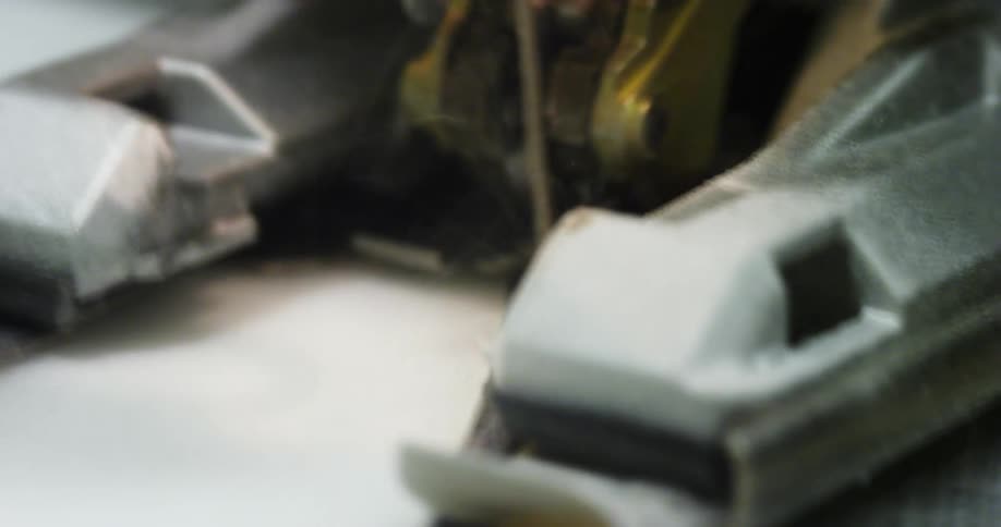 A machine shaving metal off a piece of material