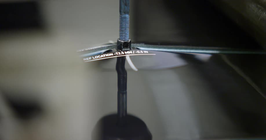 Metal rod screwed together in center is labeled
