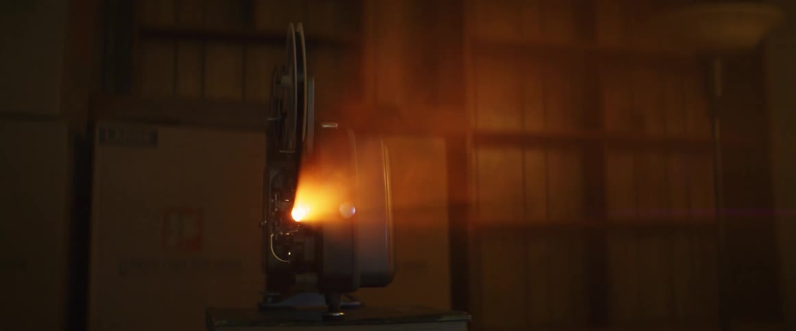 Light shining from a movie projector in a dark room