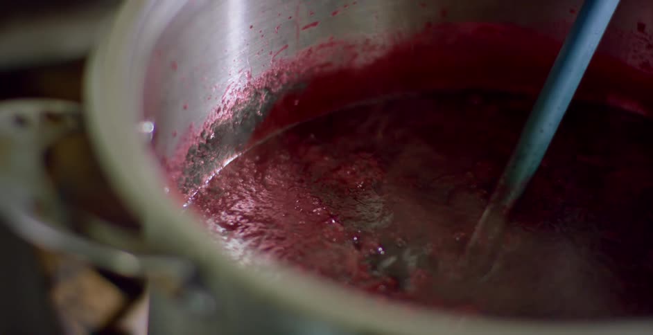 A pot of sauce simmering in a restaurant