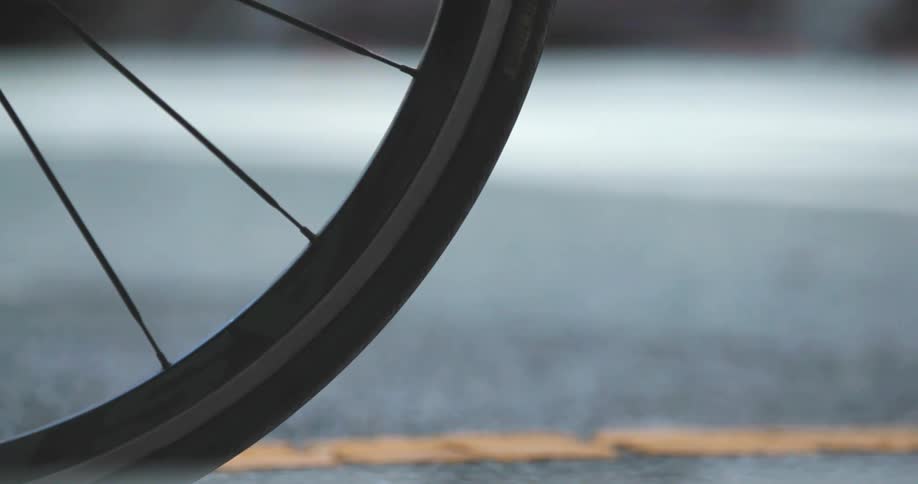 Close up of a tire with rim and spokes