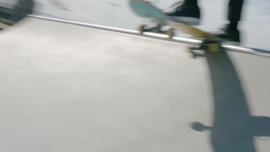 Person skateboarding on a ramp on a sunny day