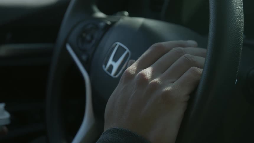 A man steers his car