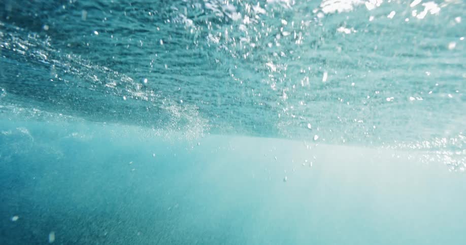 Bubbles and waves underwater in an ocean