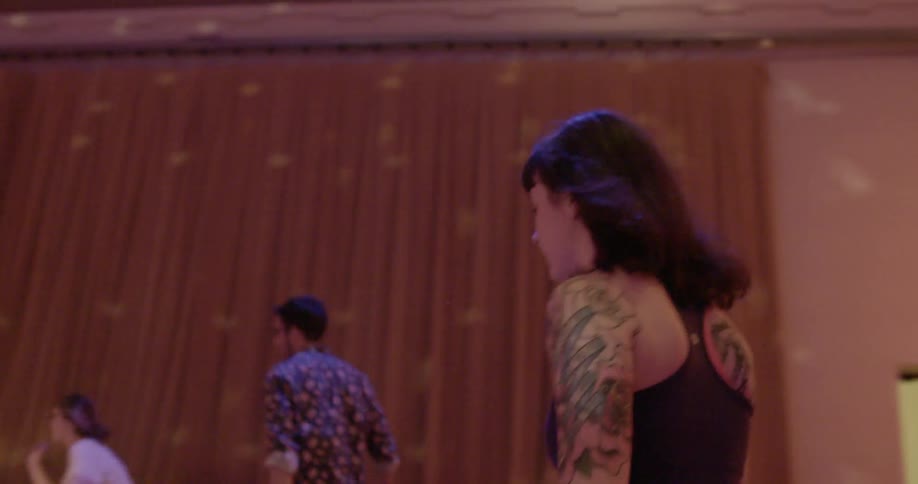 People are skating around in a skate room