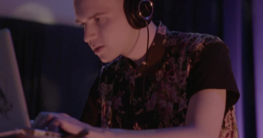 A man is being a dj bobbing his head