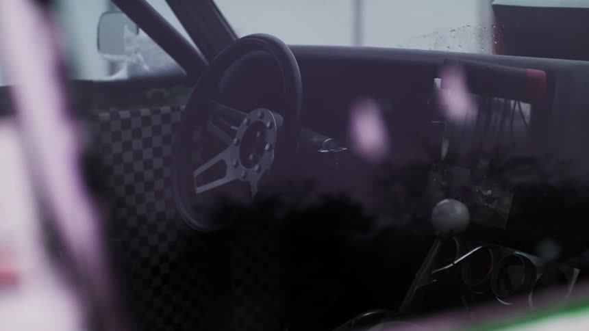 The inside of a vehicle that has a gear shift and steering wheel