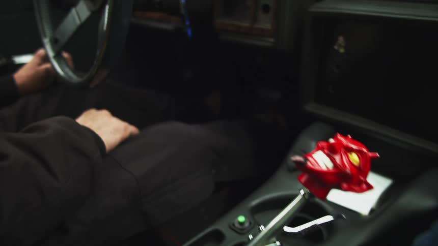 A person turns the ignition of their truck