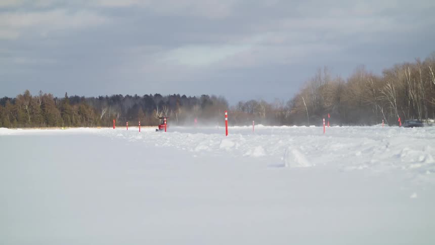 Vehicles racing in the snow