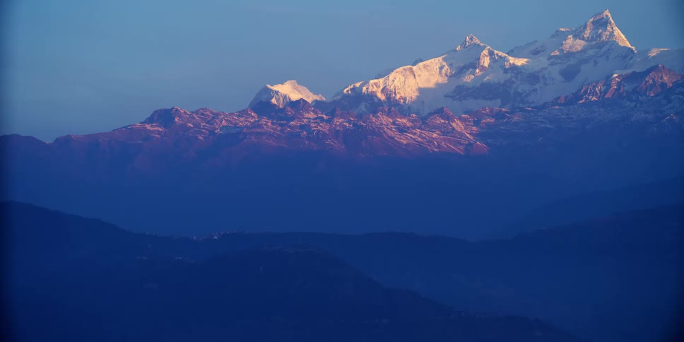 A snowy mountain range in the winter