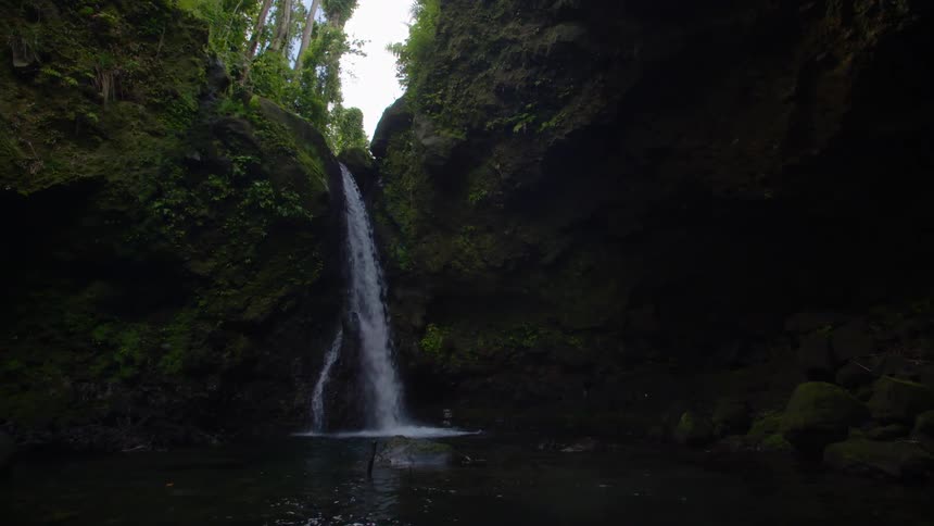 A waterfall is displayed during midday