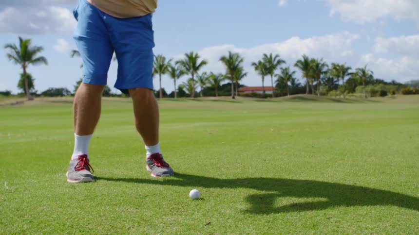 A man golfing on a golf course
