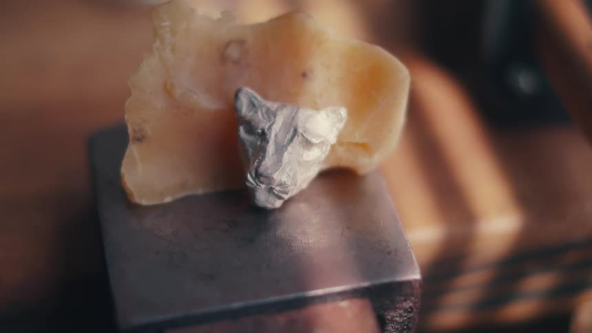 Small tiger head ornament sits on a square table