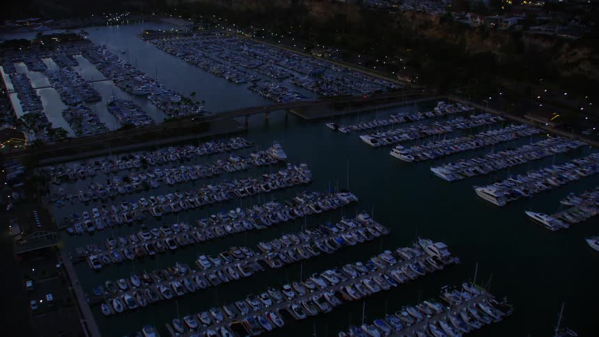 An aerial view of a marina with boats and a bridge, Dana Point