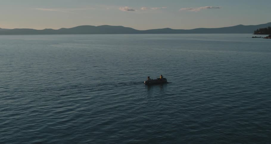 Two people in a boat on a lake