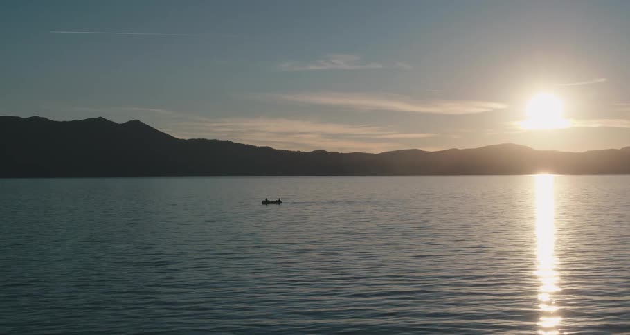 Two people on a boat on a river