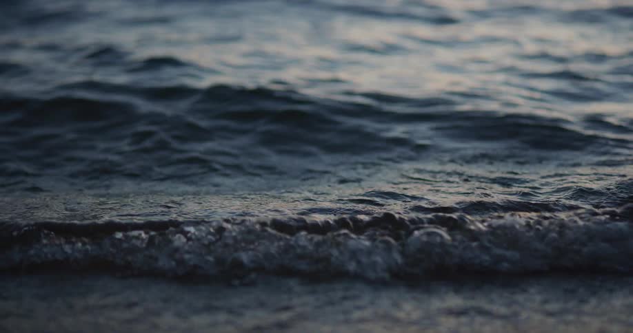 Ocean waves washing ashore a beach