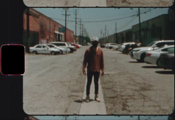 A man standing in a parking lot