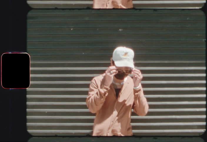 Man wearing face mask puts on sunglasses
