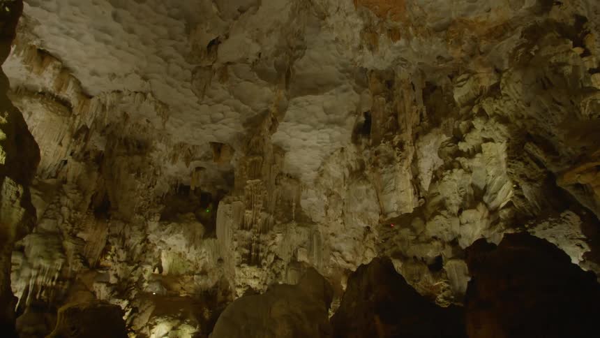 Inside of a cave with rockstalagmites and stalactites
