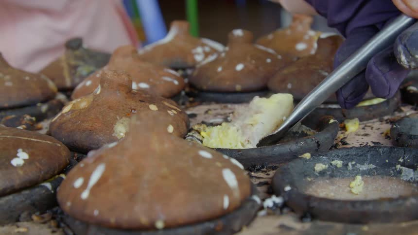 A person cooking at a market