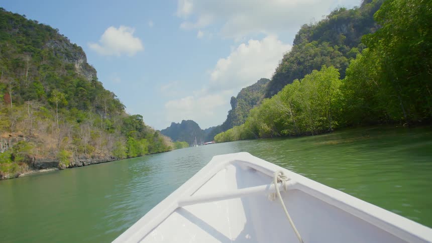 A boat travelling down a river