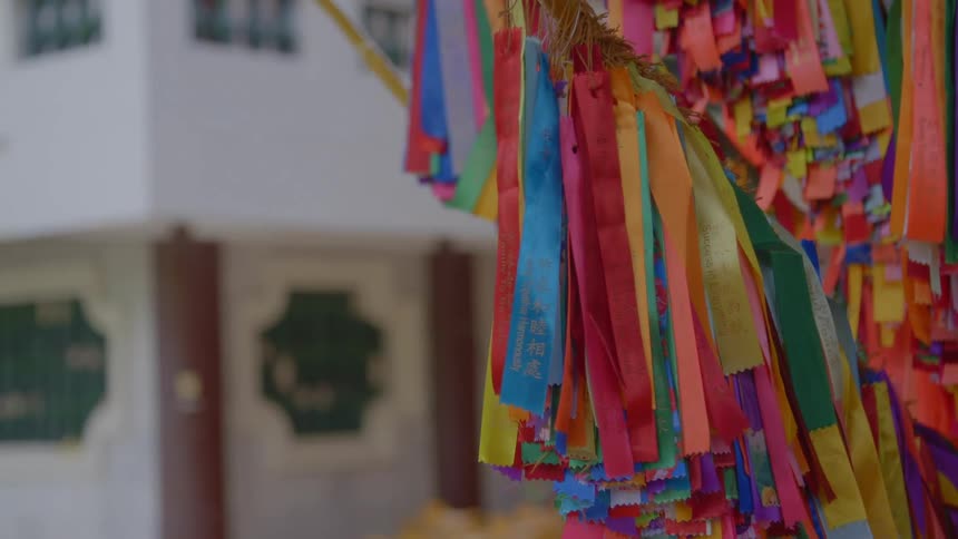 Colorful streamers hanging outside of a building