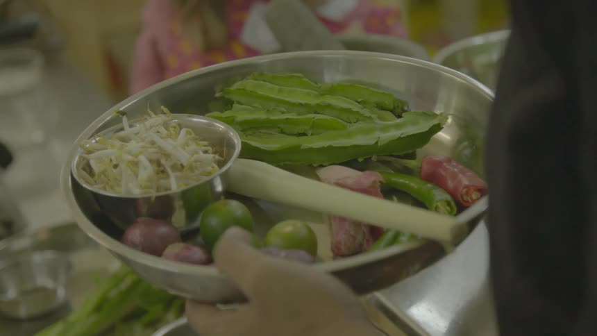 A person with a dish of food