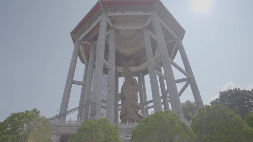 A view of a massive statue in a ramada