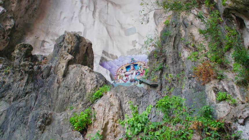A man resting on a cliff