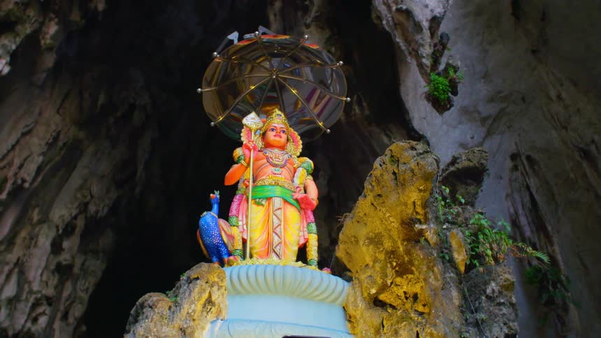 A statue is inside of the cave