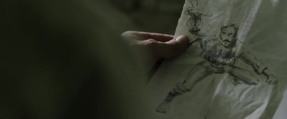 An elderly person holds a sketch and a revolver