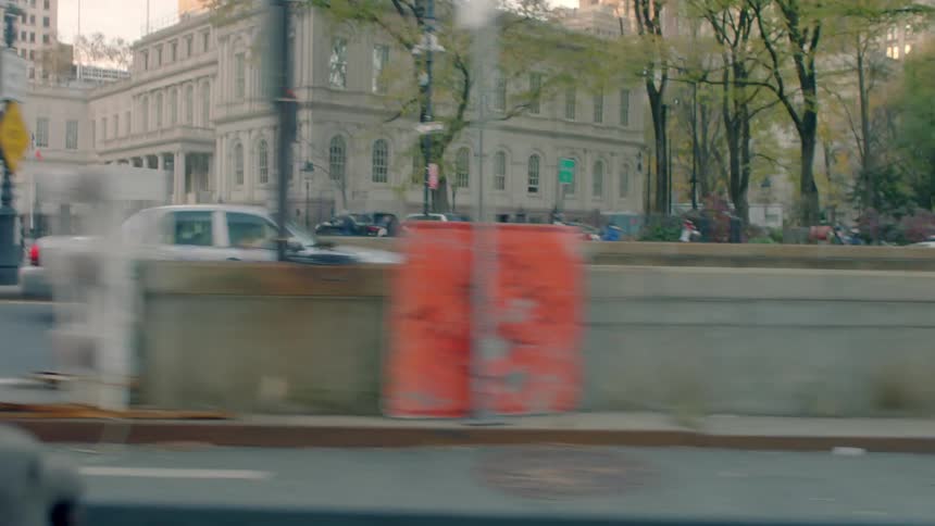 Vehicles are traveling down a city street