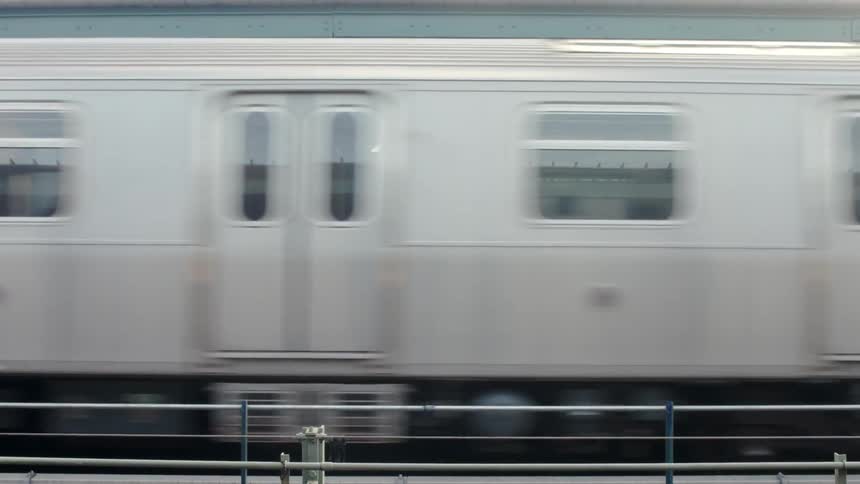 A train is passing by a station