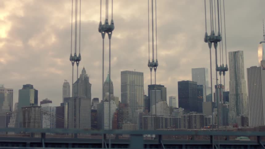 Crossing a bridge with a large city nearby