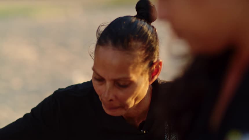 A woman talks with someone