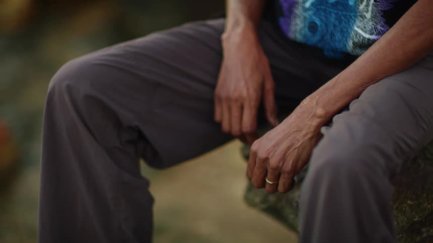An aboriginal woman sitting down