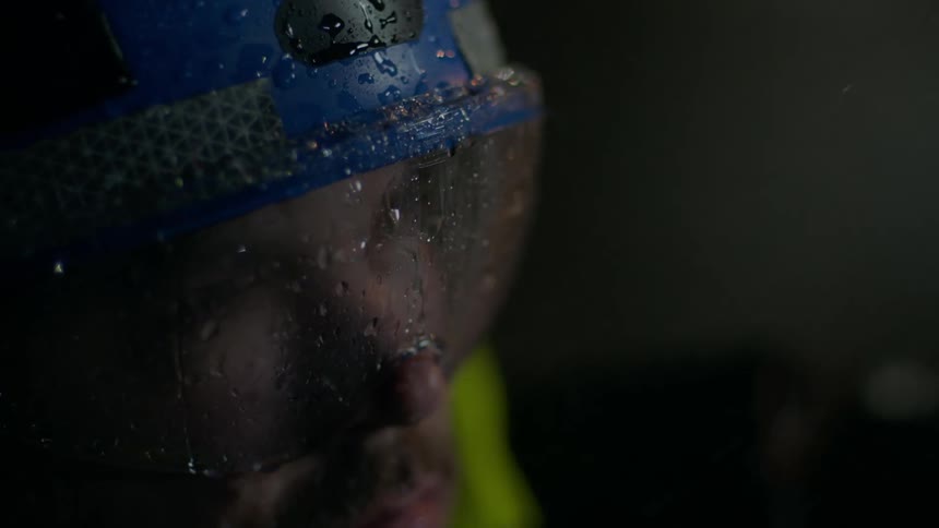 Rain pours down on a man outside