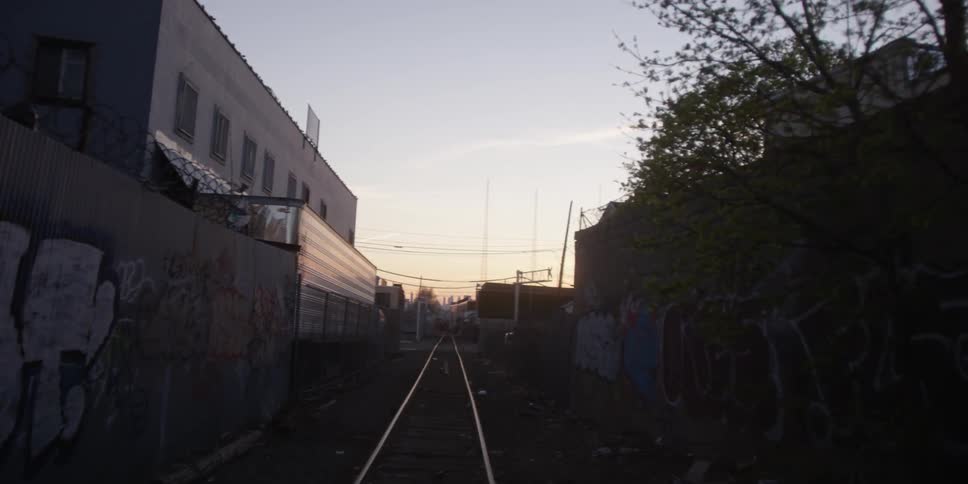 Train tracks running through a slum area