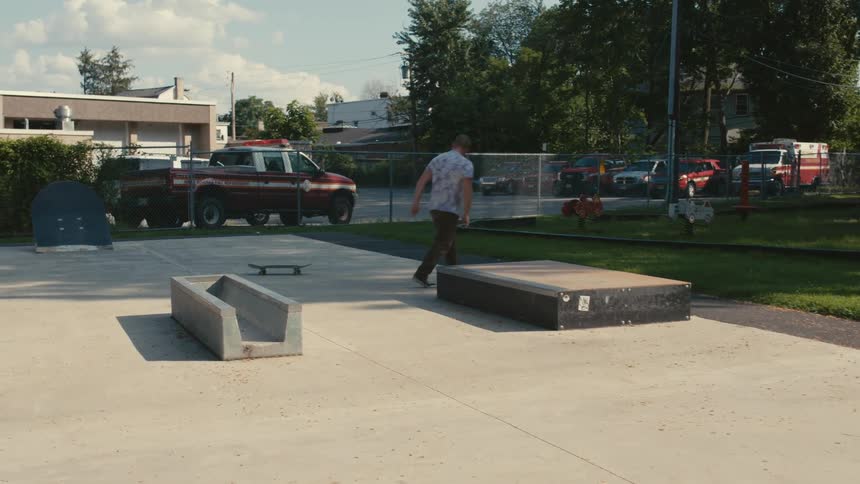 A man riding a skateboard at a skate park