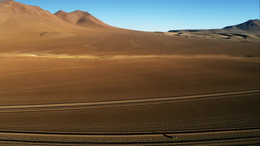 A person is racing across the desert