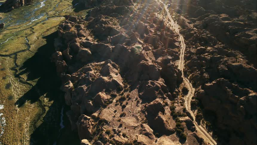 Road winds through rough rocky terrain