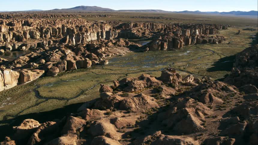Aerial view of a river flowing through canyons