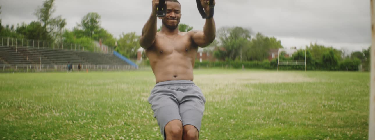A man is exercising in the park