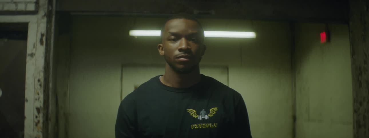 A man is standing in an empty room