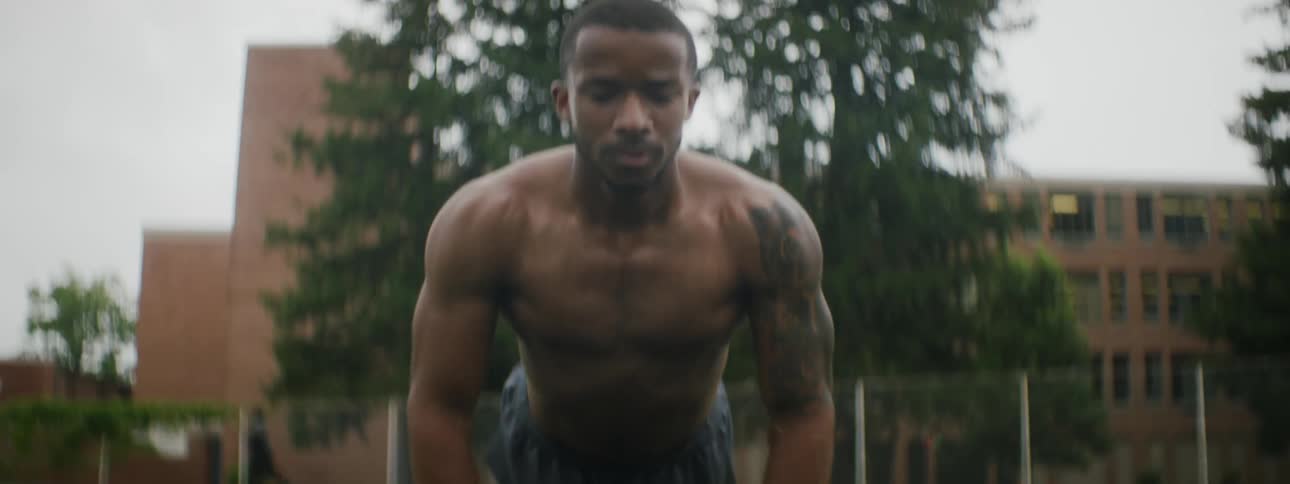 A man is exercising outdoors in spring