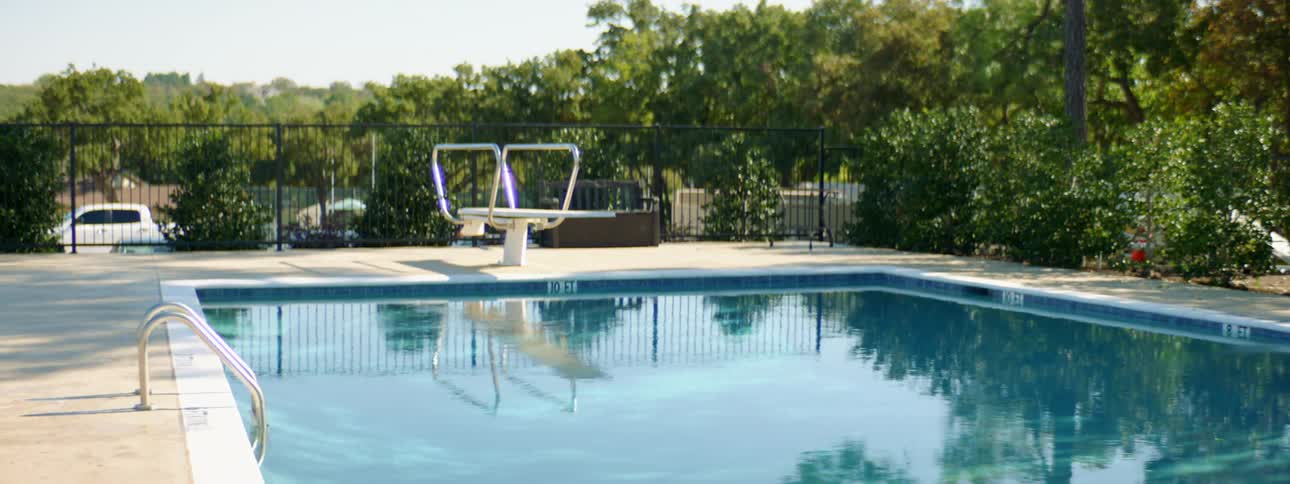 Outdoor swimming pool with diving board