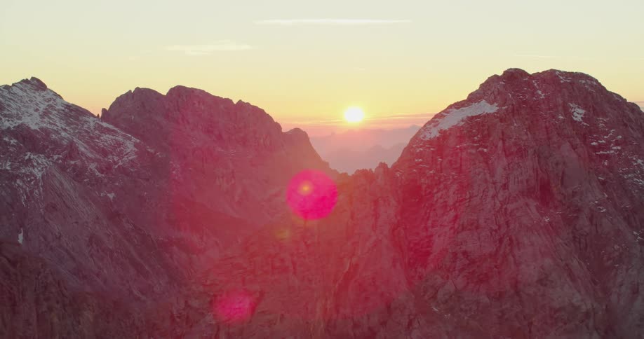 Sunrise between mountain peaks