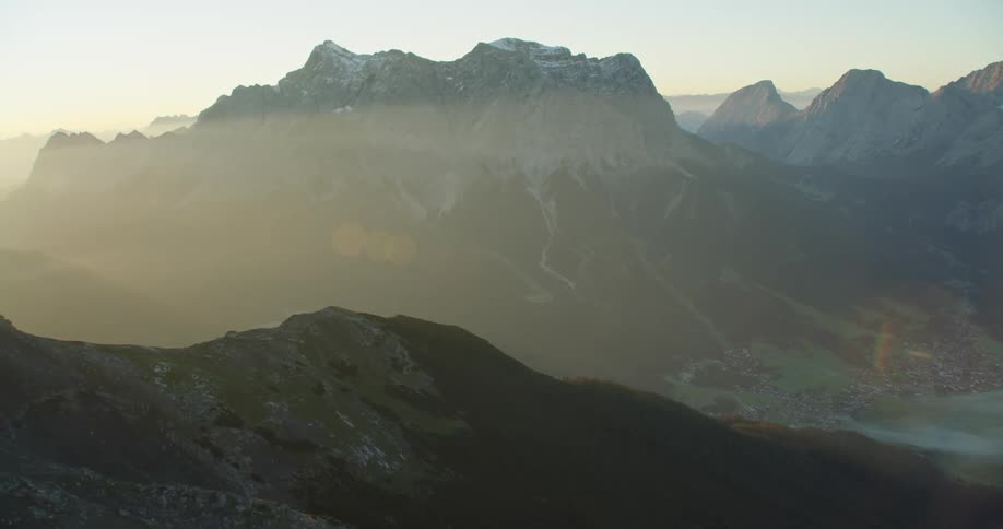 Fog is covering the town by the mountain