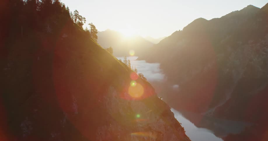 Aerial view of mountains at dusk is displayed